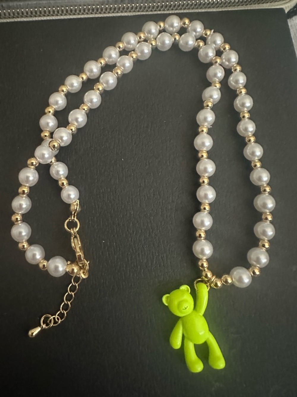 Neckale gold tone green bear